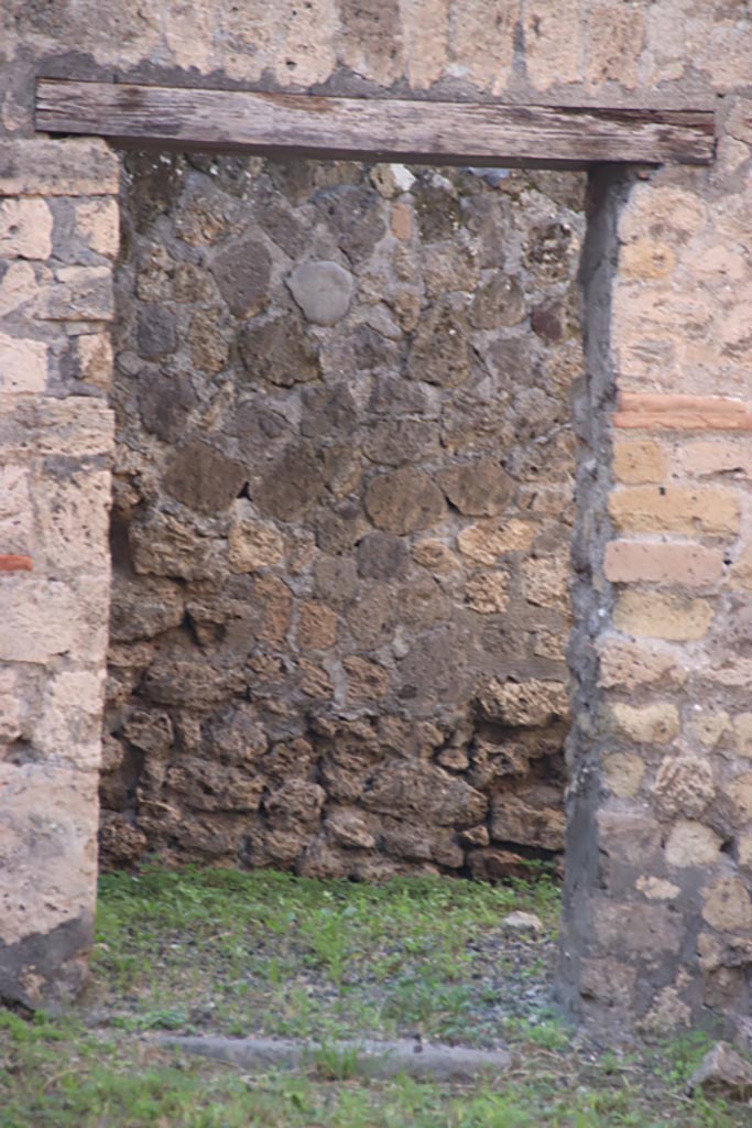 VI.7.15 Pompeii. October 2022. 
Doorway in west wall into a rear room. Photo courtesy of Klaus Heese.