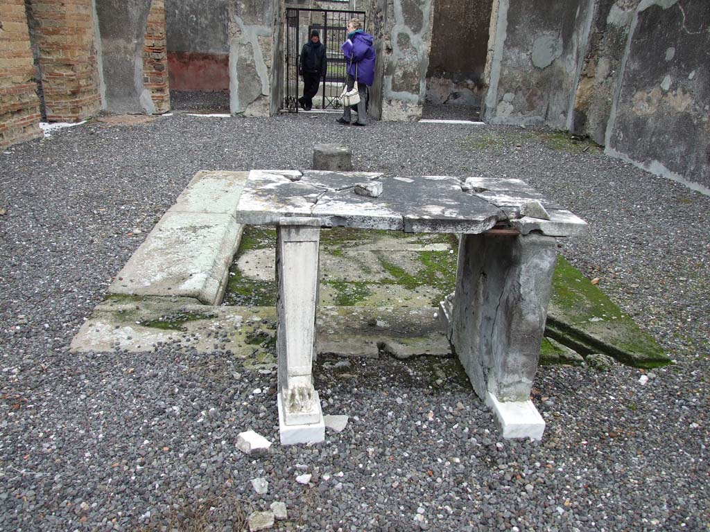 VI.7.19 Pompeii. December 2006.  
Looking east from rear of table, across atrium to entrance doorway and doorway to bedroom on either side.