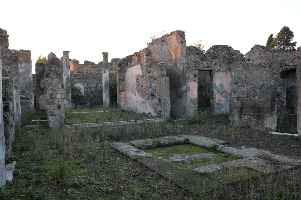 VI.7.20 Pompeii. December 2018. 
Looking north-west across impluvium in atrium towards north wall of tablinum and corridor to rear. Photo courtesy of Aude Durand.
