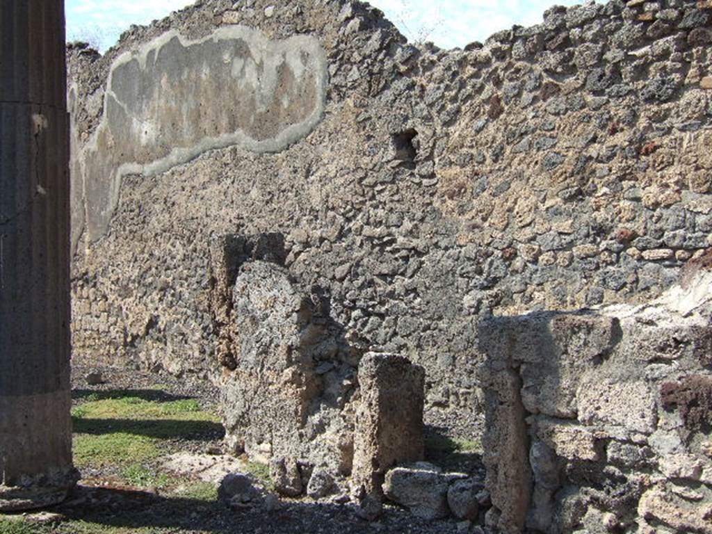 VI.7.21 Pompeii.  North side of entrance vestibule with small doorway under site of stairs to upper floor.
