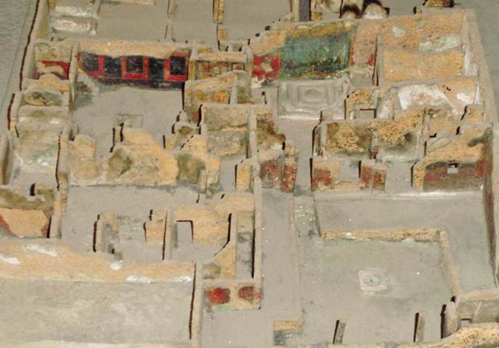VI.7.23 Pompeii.  Model of Casa di Apollo (from Naples Archaeological Museum). Photo courtesy of Davide Peluso. The fountain with the garden painting on the wall behind it can be seen in the top right-hand corner. The entrance and atrium are seen in the top left-hand corner.
