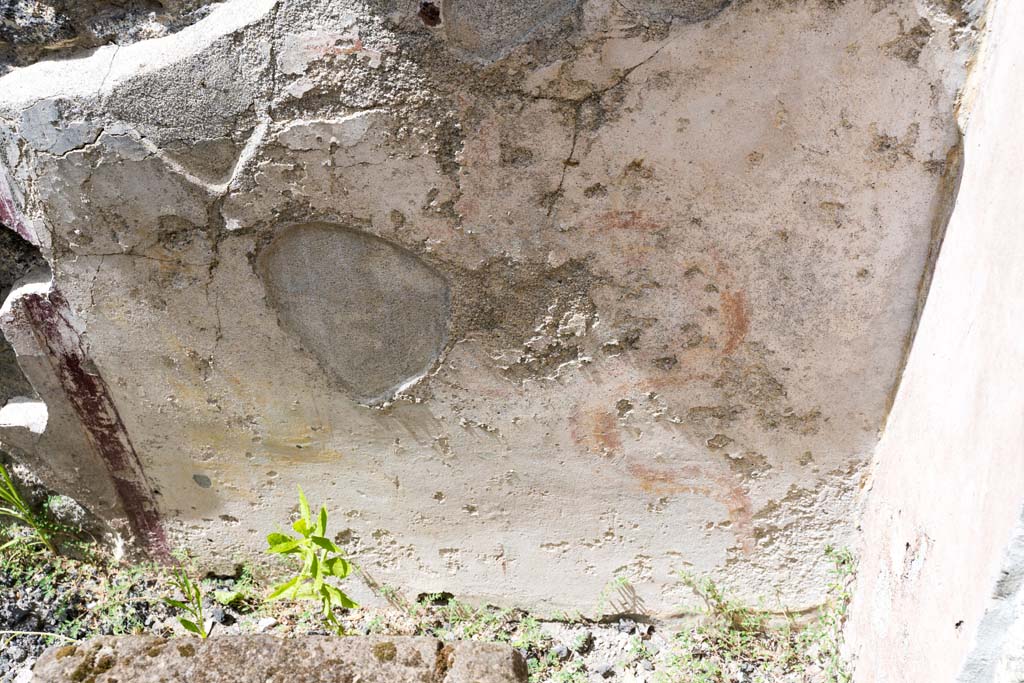 VI.7.23 Pompeii. July 2021. 
Detail of wall below lararium niche, with remaining painted serpent just visible. Photo courtesy of Johannes Eber.