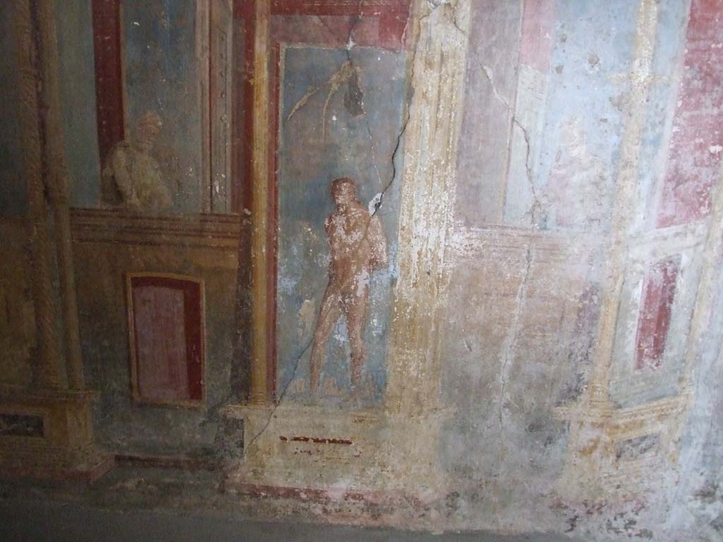 VI.7.23 Pompeii. December 2006. Cubiculum. South alcove, west wall.
According to Caso this is Marsyas with his hands tied behind his back. 
To the left is a male figure looking down from a balustrade.
See Caso L., in Rivista di Studi Pompeiani III, 1989, p. 112.
