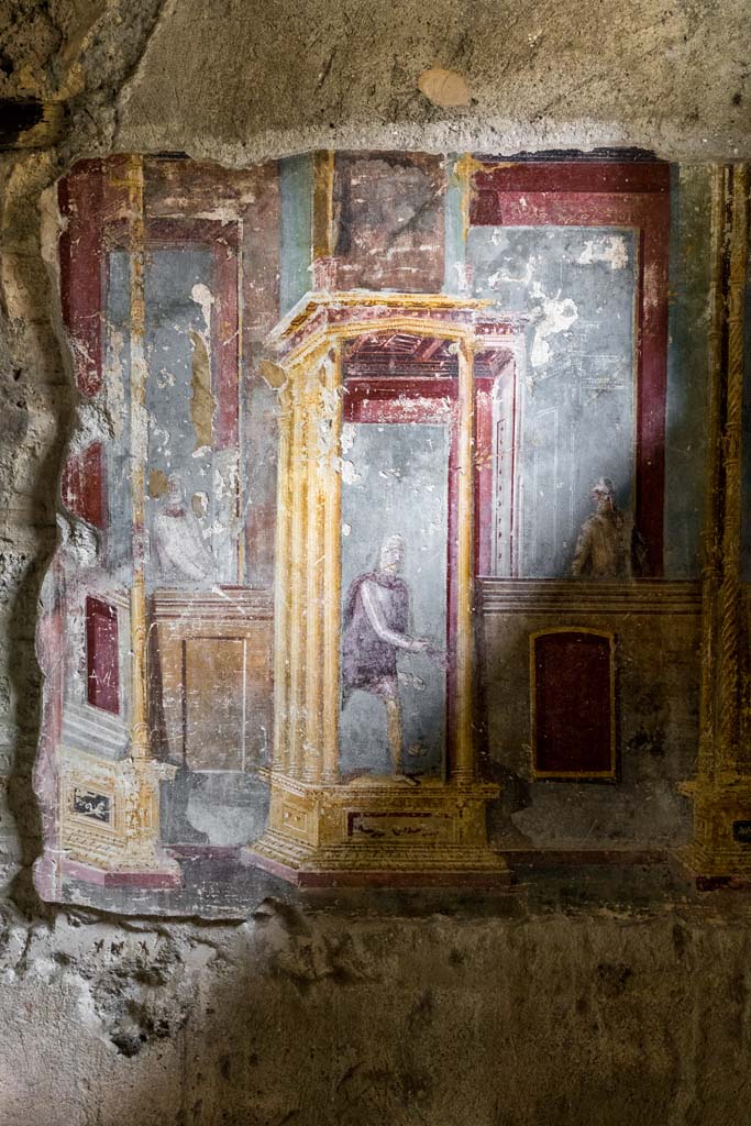 VI.7.23 Pompeii. July 2021. 
Looking towards south alcove, east wall with paintings of a central male figure in oriental attire and figures at balconies. 
Photo courtesy of Johannes Eber.