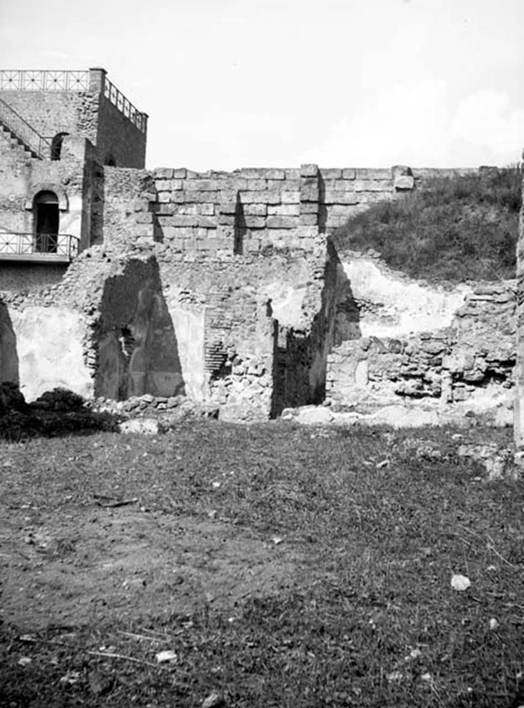 231225 Bestand-D-DAI-ROM-W.637.jpg
6.9.1 Pompeii. W637. 
Looking north from garden area (room 18) towards rooms 12, 11, and small corridor leading to room 8.
Photo by Tatiana Warscher. With kind permission of DAI Rome, whose copyright it remains. 
See http://arachne.uni-koeln.de/item/marbilderbestand/231225  
According to Warscher, in room 11, (Warscher’s room “L” the yellow triclinium, seen left of centre in the photo), in the left wall was a hole. It could not be excluded that this hole was what remained after the painting of Io was taken out.
See Warscher, T, 1938: Codex Topographicus Pompejanus, Regio VI, insula 9: Pars prima, (no.17c), DAIR, Rome.