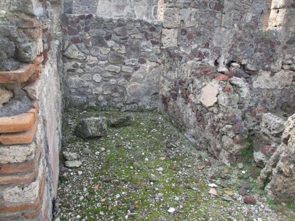 VI.9.1 Pompeii. December 2007. Room 20, looking west. According to Packer, in number 20 (or 7on his plan) the walls would have been decorated with yellow panels separated by red borders. Originally this would have been the entrance corridor of a previously separate house, which was then converted into bedroom use. 
See Cronache Pompeiane, IV, 1978, for article by Packer, J: Inns at Pompeii: a short survey (p.26)
According to Warscher, "the room "i”, open in its entire width to the triclinium "O” was rebuilt from the fauces of a second house, already mentioned. Here also you will find traces of very coarse painting – perhaps if I am not mistaken – griffins are represented here”. 
See Warscher, T, 1938: Codex Topographicus Pompejanus, Regio VI, insula 9: Pars prima, DAIR, Rome.