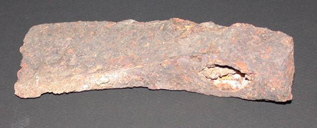 VI.9.1 Iron axe head, rear view.  Height 0.033m, width 0.057m, length 0.14m.  
OA 2811 Hache, musée Condé, photo RMN © R.G. Ojeda