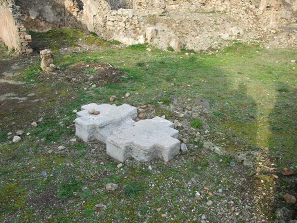 VI.9.1 Pompeii. December 2007. Looking north-east from atrium towards room 11, in rear left. According to Warscher, quoting Fiorelli, 
“The solid remains of travertine on which rested the chest for money paid by patrons can still be seen in the atrium, standing in front of three doors: the first that led into a second triclinium, (our room 11), followed by three rustic rooms at the top, and a cubiculum below with painted plaster.  The second doorway (see photograph no. 19), and the third doorway (see no. 13) both entered into the walkway on the north side of the xystus, defined by a podium, and with channels to receive the flowing rain in two cistern mouths”, (see also Warscher’s photograph no. 23).
See Pappalardo, U., 2001. La Descrizione di Pompei per Giuseppe Fiorelli (1875). Napoli: Massa Editore. (p.63)
See Warscher, T, 1938: Codex Topographicus Pompejanus, Regio VI, insula 9: Pars prima, DAIR, Rome.