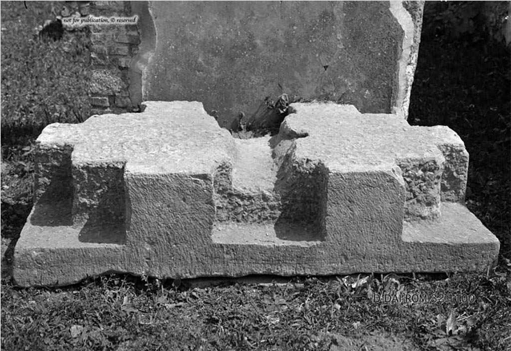 VI.9.1/14 Pompeii. Chest base. Found in the atrium. 
According to Pernice –
The stone is notched at right angles at the four corners and has a strong notch on the front for a third foot. 
From this notch a deep groove runs across the pedestal (this probably took a strong wooden beam that was placed under the bottom of the box and thus increased the firm connection between the base and the box). 
To the right of the groove is a square hole with traces of iron for a spike that went through the bottom of the box.
See Pernice, E., 1932. Hellenistische Tische, Zisternenmündungen, Beckenuntersätze, Altäre u. Truhen. Berlin, p. 73, Taf. 44.2.
DAIR 32.1100. Photo © Deutsches Archäologisches Institut, Abteilung Rom, Arkiv. 
Thanks to Espen B. Andersson for assisting us in our interest in money-chests.