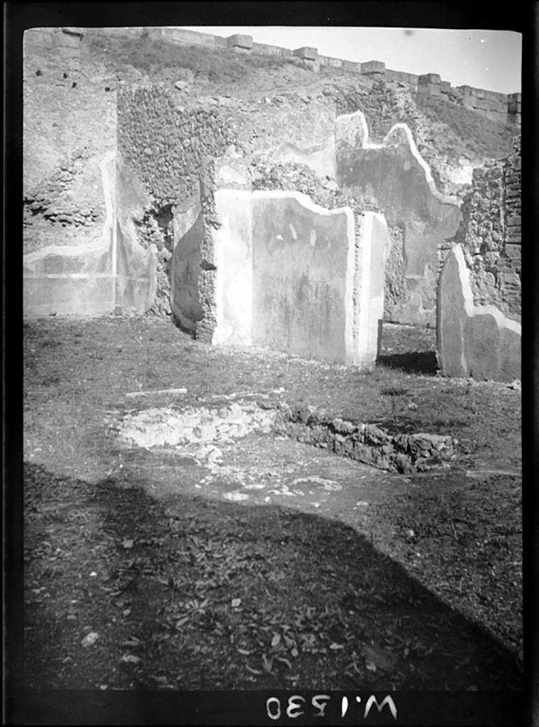 VI.9.1 Pompeii.  W1530. North-east corner of atrium, 
On the left would have been room 12, the oecus with the open doorway into the atrium. 
The doorway in the east wall of the atrium, on the right, would have led into a large triclinium.
Photo by Tatiana Warscher. Photo © Deutsches Archäologisches Institut, Abteilung Rom, Arkiv. 
According to Warscher, this photo showed the atrium and ala “K”.
The atrium had a rectangular shape, it was wider than it was longer, size 8,10m + 4,10m.
The impluvium (sized 2,60m + 1.50m) would have been covered with marble, as shown by a piece that one can see in the border. 
See Warscher, T, 1938: Codex Topographicus Pompejanus, Regio VI, insula 9: Pars prima, (no.11), DAIR, Rome.