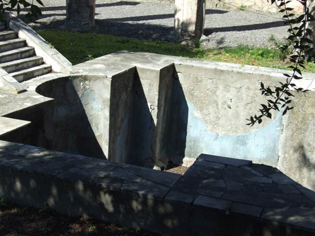 VI.9.2 Pompeii.  March 2009.  Peristyle garden 17, west end of pool 18 with blue painted plaster.