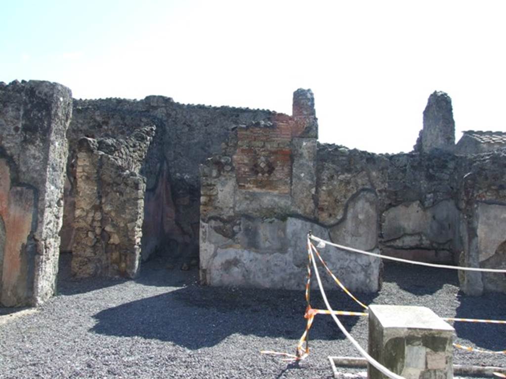 VI.9.2 Pompeii. March 2009. Room 2, south-east corner of atrium and impluvium.Looking south at doorways to rooms 15, 14 and 13.