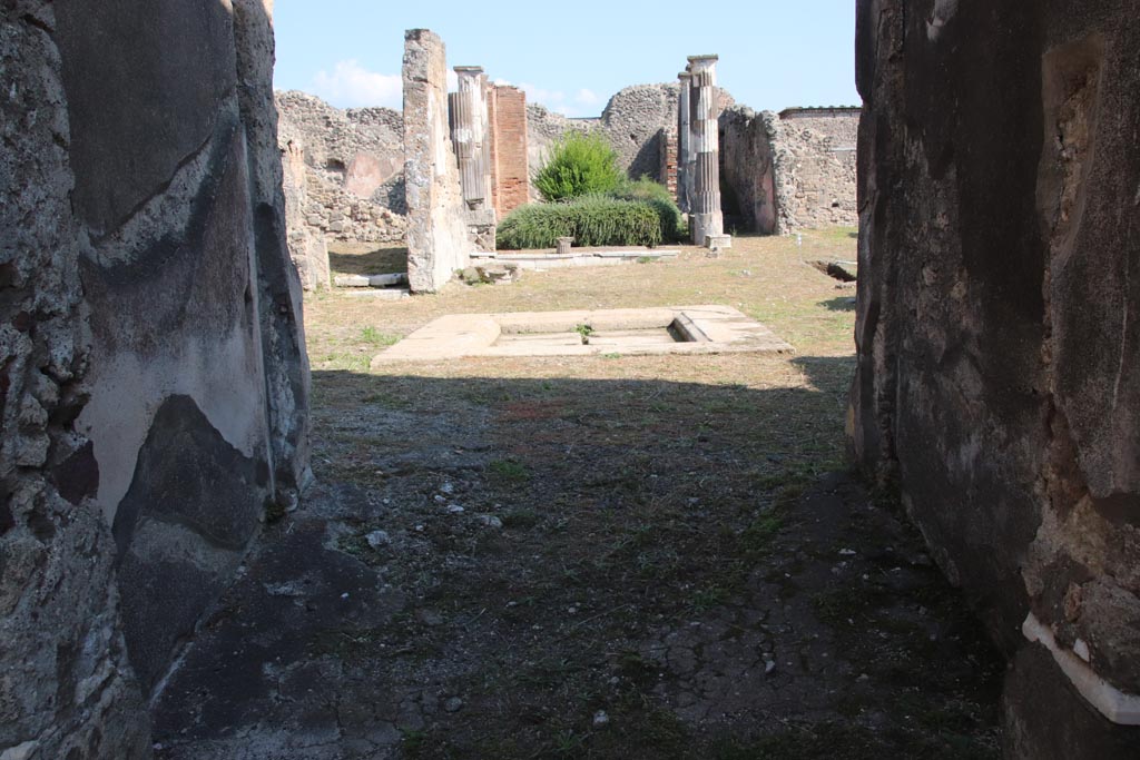 VI.9.3 Pompeii. October 2022. 
Looking east from entrance corridor/fauces (1), across atrium (4) towards tablinum (6). Photo courtesy of Klaus Heese.