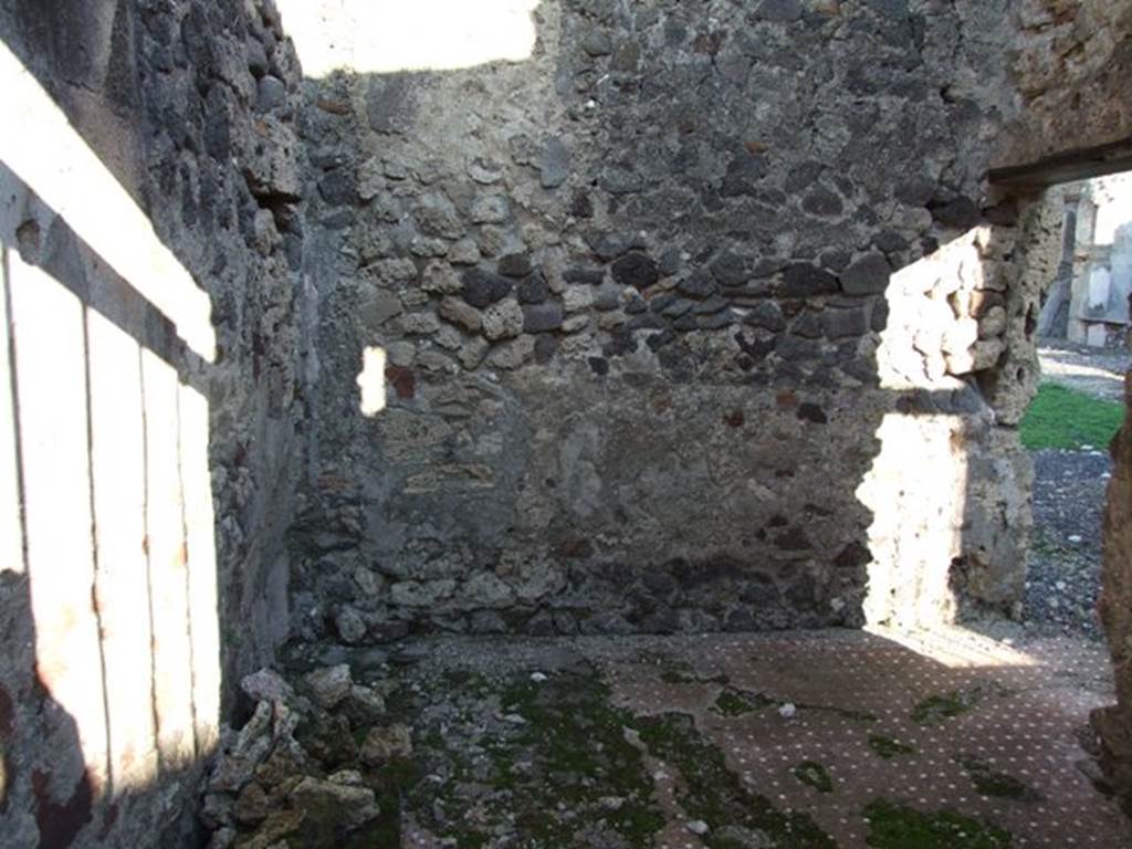 VI.9.4 Pompeii. December 2007. Looking east from entrance into room 15.  
According to Fiorelli, this was a room with a staircase to the upper floor and a separate entrance doorway to the Via. He also said that at some time a servant name Paris wrote his graffito for posterity –
Paris hic
fuit
See Pappalardo, U., 2001. La Descrizione di Pompei per Giuseppe Fiorelli (1875). Napoli: Massa Editore. (p.65) 
Paris was here. (CIL IV 1305)
See Berry, J., 2007. The Complete Pompeii. London: Thames & Hudson. (p.103)