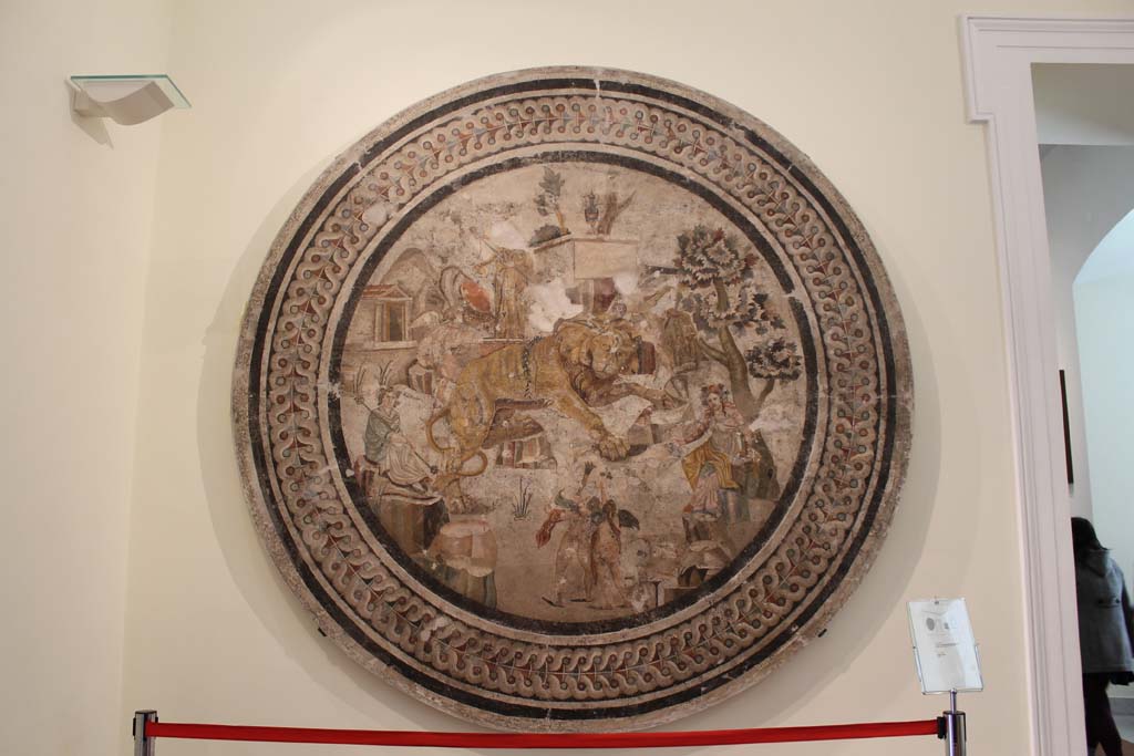 VI.9.5, Pompeii. March 2014. 
Mosaic of lion and cupids between Dionysus and maenads, on display on a wall in Naples Museum.
Found in April 1829 in triclinium 27. 
Now in Naples Archaeological Museum. Inventory number 10019.
Foto Annette Haug, ERC Grant 681269 DÉCOR.