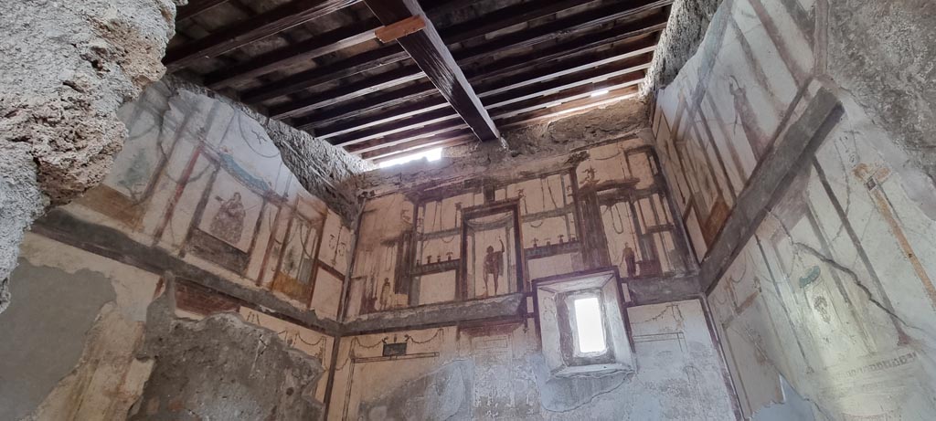 VI.9.6 Pompeii. December 2023. 
Room 16, looking through doorway towards upper walls with painted decoration. Photo courtesy of Miriam Colomer.