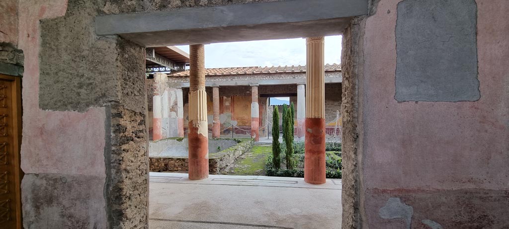 VI.9.6 Pompeii. December 2023. 
Looking south through doorway to room 6, entrance to peristyle on south side of room 4. Photo courtesy of Miriam Colomer.