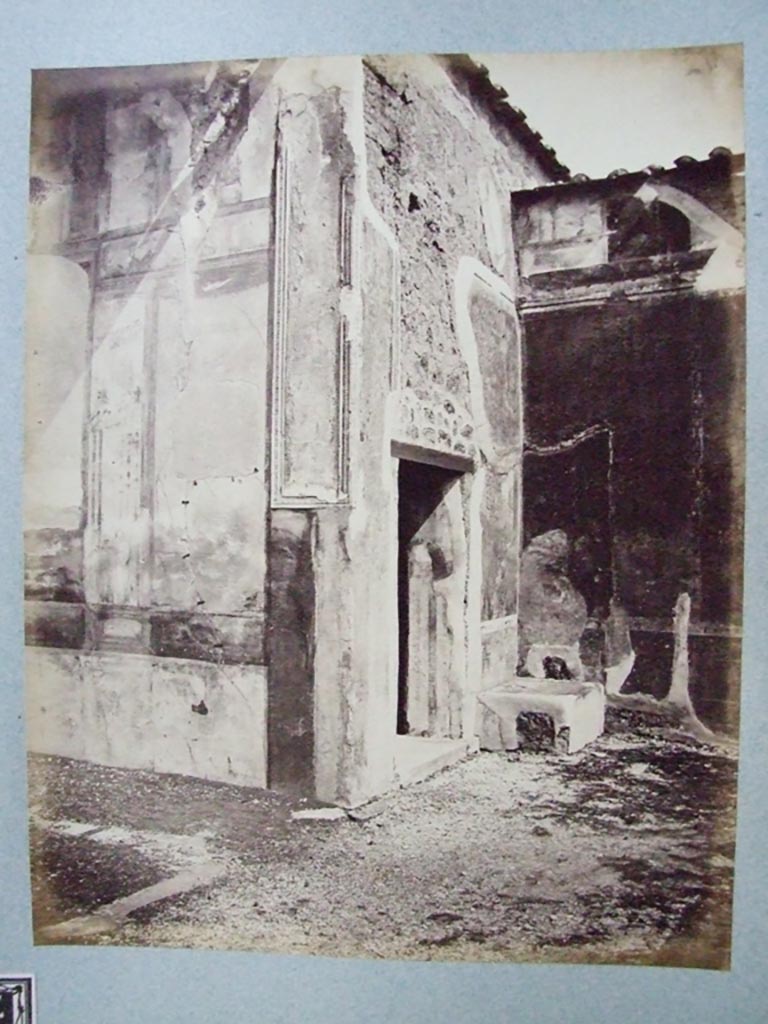 This is shown on the Fox collection list as “the corner of tablinum showing entrance to fauces”. 
The entrance is in fact a room on the right of the tablinum with a window to the garden, (our room 8). 
Old undated photograph courtesy of the Society of Antiquaries, Fox Collection.