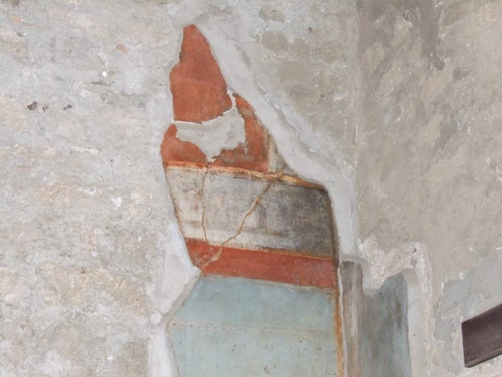 VI.9.6 Pompeii. March 2009. Room 8, remains of painted decoration from east end of upper north wall.