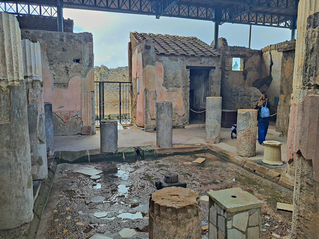 VI.9.6 Pompeii. November 2023. 
Room 3, looking west across impluvium in atrium from outside room 9, tablinum. Photo courtesy of Giuseppe Ciaramella.