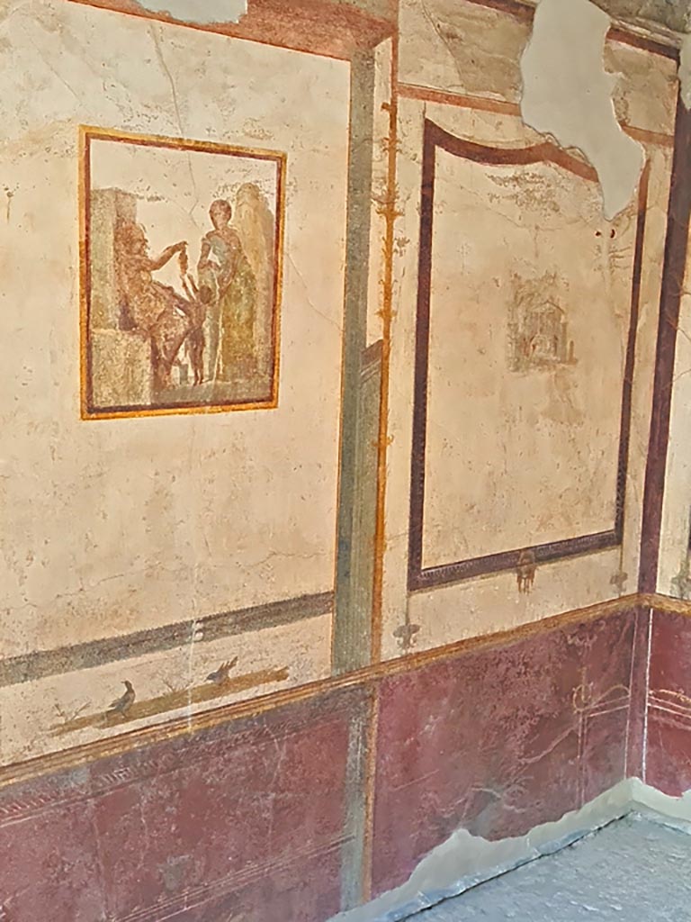 VI.9.6 Pompeii. November 2023. 
Room 21, central painting on south wall and south-west corner. Photo courtesy of Giuseppe Ciaramella.