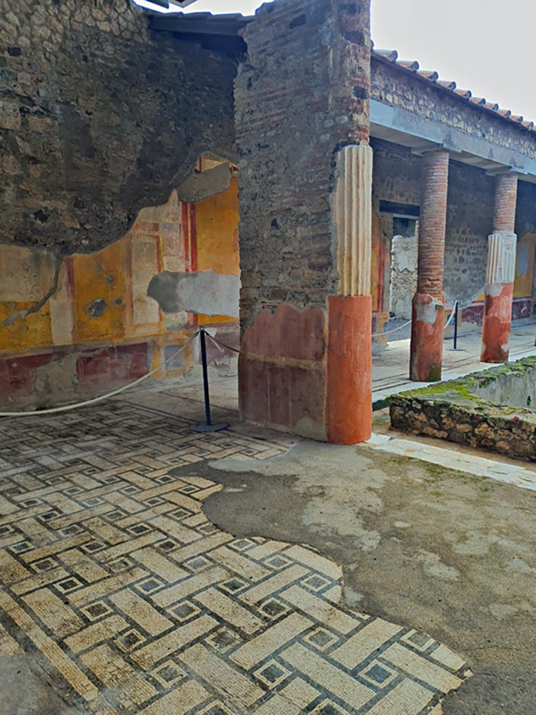 VI.9.6 Pompeii. November 2023. 
Room 6, looking south-west across east portico towards pilaster. Photo courtesy of Giuseppe Ciaramella.