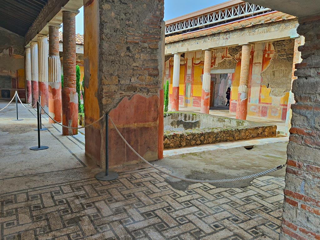 VI.9.6 Pompeii. November 2023. 
Room 6, looking west across east portico towards pilaster in south-east corner. Photo courtesy of Giuseppe Ciaramella.