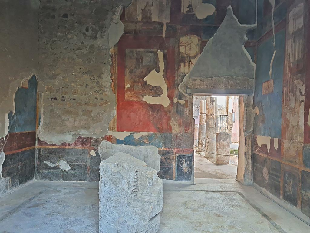 VI.9.6 Pompeii. November 2023. 
Room 8, looking towards west wall through window from garden area, with doorway into atrium, on right.
Photo courtesy of Giuseppe Ciaramella.