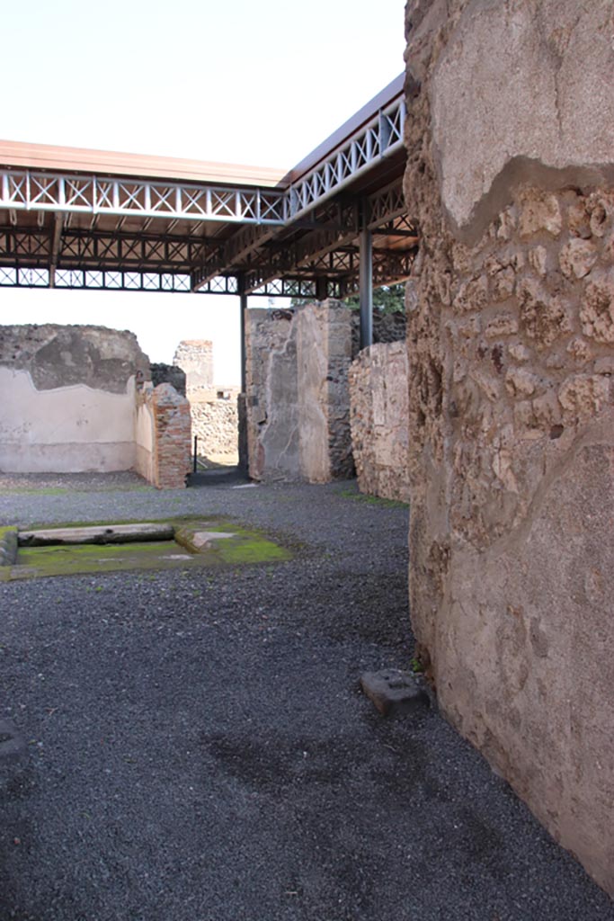 VI.9.7 Pompeii. October 2022. 
Room 2, looking south-east across atrium towards south-east corner with doorway to room 8 and corridor 11.
Photo courtesy of Klaus Heese.