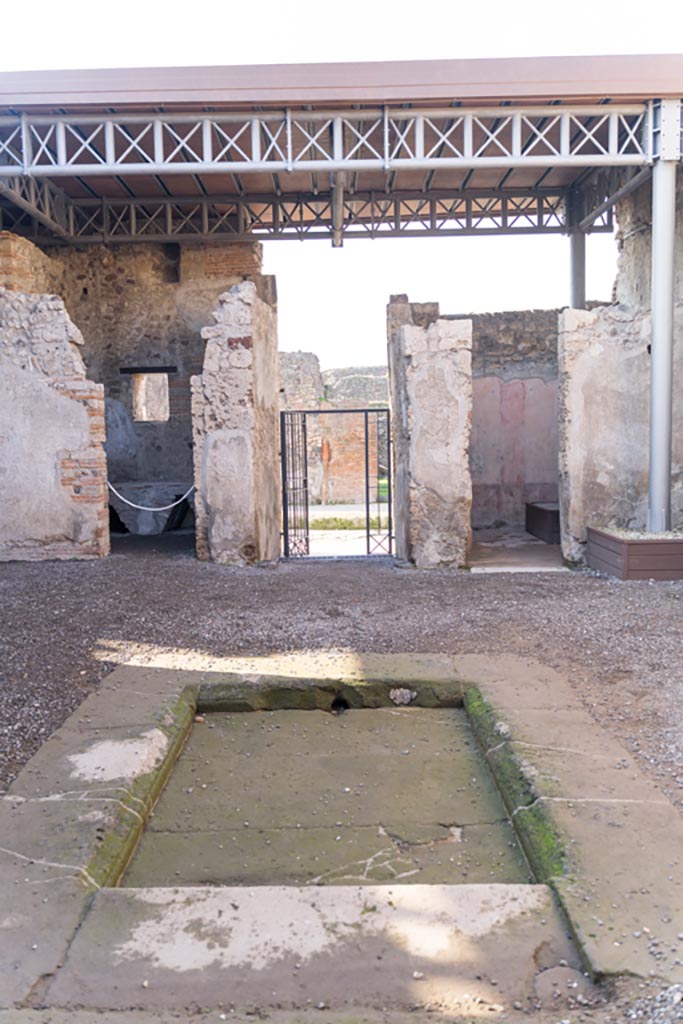 VI.9.7 Pompeii. January 2023. 
Looking west across impluvium in atrium, room 2. Photo courtesy of Johannes Eber.