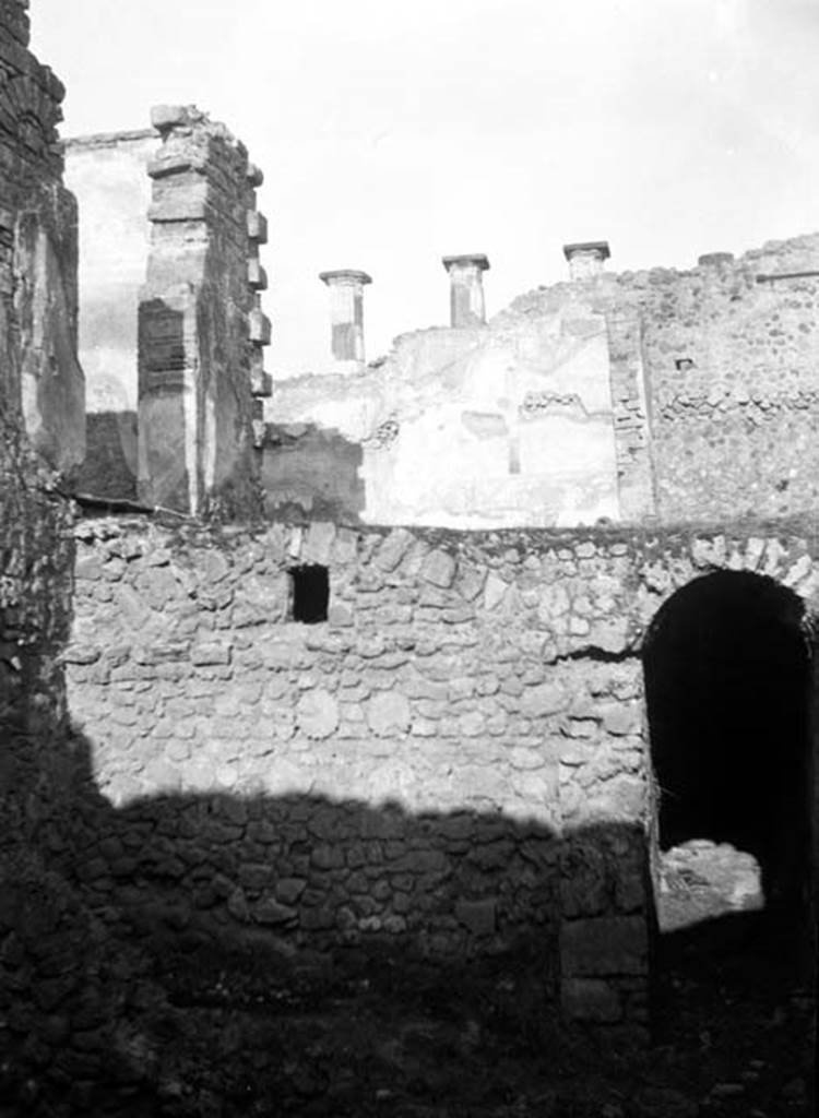 230881 Bestand-D-DAI-ROM-W.729.jpg
6.9.11 Pompeii. W729. Looking north towards entrance to corridor and underground kitchen, on lower level. On the left of the upper level are the doorways from the tablinum 26 and triclinium 27 onto the peristyle at 30. Taken from rear of 6.9.5.
Photo by Tatiana Warscher. With kind permission of DAI Rome, whose copyright it remains. 
See http://arachne.uni-koeln.de/item/marbilderbestand/230881