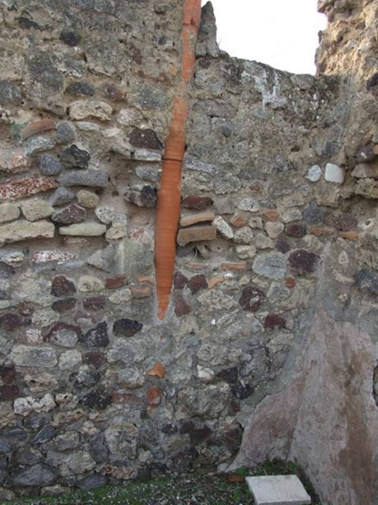 VI.9.14 Pompeii. December 2007. Down-pipe in west wall of light-yard/courtyard in corridor 29.
