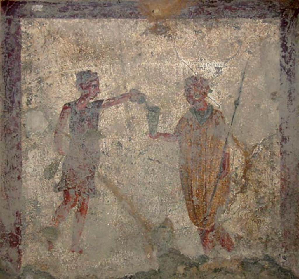 VI.10.1 Pompeii. May 2003. Fresco on north wall of rear room. A soldier with spear in his left hand holds out his cup to a slave.  
Photo courtesy of Nicolas Monteix.