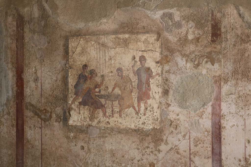 VI.10.1 Pompeii. December 2018. 
Fresco from east end of south wall of rear room, showing men gambling. Photo courtesy of Aude Durand.