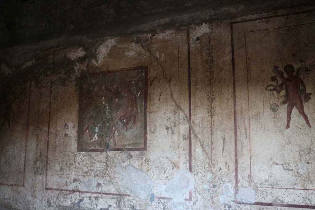 VI.10.1 Pompeii. December 2018. 
Looking towards central painting on north wall, and flying cupid on east side. Photo courtesy of Aude Durand.