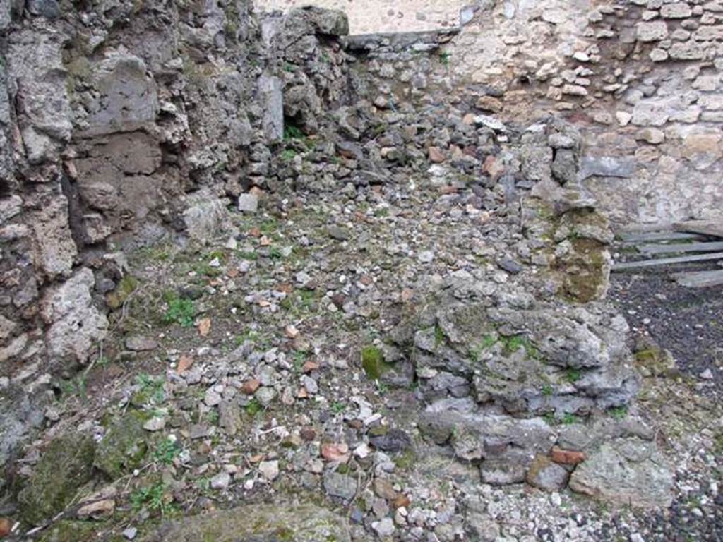 VI.10.2 Pompeii. March 2009.  Remains of room to east of oecus, this would have been the first room on the left of the peristyle. According to Garcia y Garcia, on 13th September 1943 at 5 in the evening, a huge bomb fell on the north-east section of the house. This caused the total ruin of three rooms with the total loss of all paintings and wall plaster and stucco.
The north-east and east perimeter walls were also destroyed. See Garcia y Garcia, L., 2006. Danni di guerra a Pompei. Rome: L’Erma di Bretschneider. (p.80, and figs 150-153)
