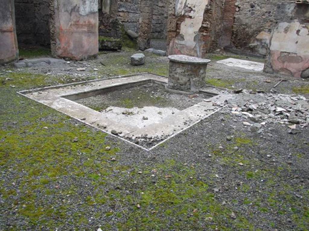 VI.10.11 Pompeii. March 2009. Room 3, mosaic impluvium with marble sides and remains of mosaic puteal which supported a table.  According to Breton, the puteal was found with a mosaic representing a river god, a head of Jupiter, griffins, masks, and other subjects, of which not a lot remained. 
See Breton, Ernest. 1870. Pompeia, Guide de visite a Pompei, 3rd ed. Paris, Guerin.