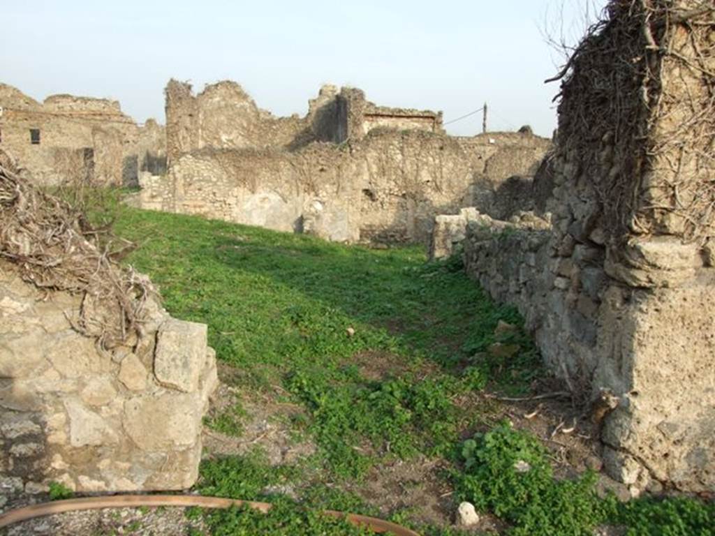 VI.11.3 Pompeii. December 2007. Entrance doorway, looking east.
According to Garcia y Garcia, a bomb fell on this area in 1943, causing some damage. When the area was first excavated, it was discovered still ruined from antiquity, perhaps from earthquake damage.
See Garcia y Garcia, L., 2006. Danni di guerra a Pompei. Rome: L’Erma di Bretschneider. (p.80) According to Jashemski, the garden area (excavated around 1842) occupied an area directly east of the entrance. After the damaged buildings had been cleared, it was used as a garden. See Jashemski, W. F., 1993. The Gardens of Pompeii, Volume II: Appendices. New York: Caratzas, (p.143)