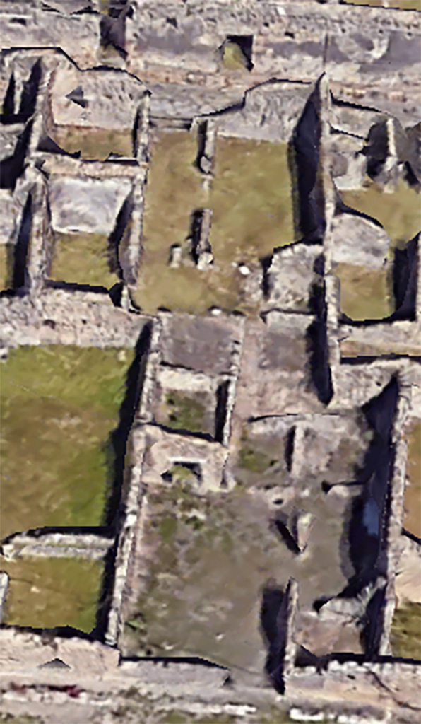 VI.11.4/17 Pompeii. Google Earth. 2023. 
Looking east from VI.11.4 entrance doorway into workshop, lower centre.