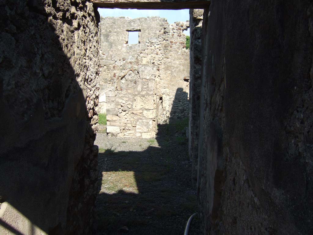 VI.11.8 Pompeii. September 2005. Looking east from entrance towards rooms 54 and 53.