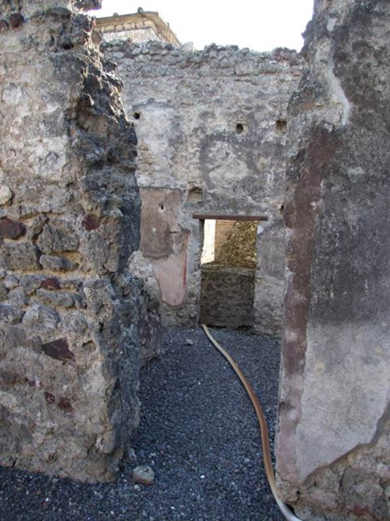 VI.11.8 Pompeii. December 2007. 
Doorway to room 56, looking south towards doorway to corridor 51 and rear of oven.