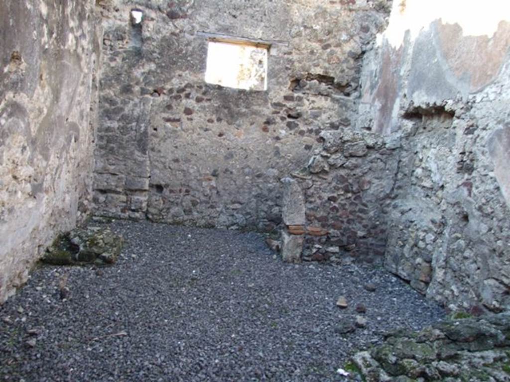 VI.11.8 Pompeii. December 2007. Room 56, looking west.  
Against the north wall, on right, would have been the stairs to the upper floor, and in the north-west corner under the stairs is the latrine. On the left, against the south wall was probably a hearth or a bench.