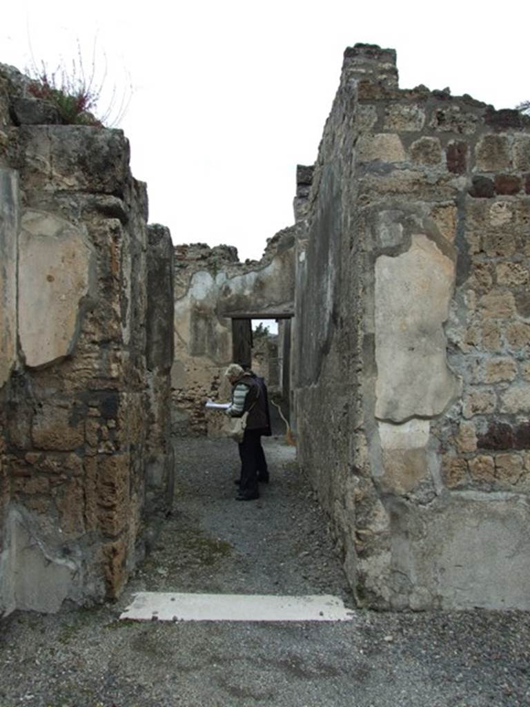 VI.11.9 Pompeii. March 2009. 
Doorway to, corridor 15 on north side of atrium leading to services, baths and bakery area.