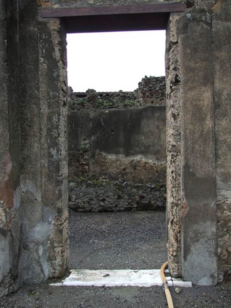 VI.11.9 Pompeii. December 2006. 
Doorway from west side of peristyle 36 of VI.11.10 into long corridor room, looking west.