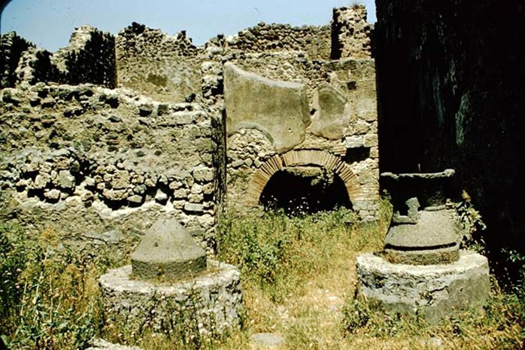 VI.11.9 Pompeii. 1957.  Looking north across bakery 16 towards oven 55 with corridor 57 at the side. Photo by Stanley A. Jashemski.
Source: The Wilhelmina and Stanley A. Jashemski archive in the University of Maryland Library, Special Collections (See collection page) and made available under the Creative Commons Attribution-Non-Commercial License v.4. See Licence and use details.
J57f0340