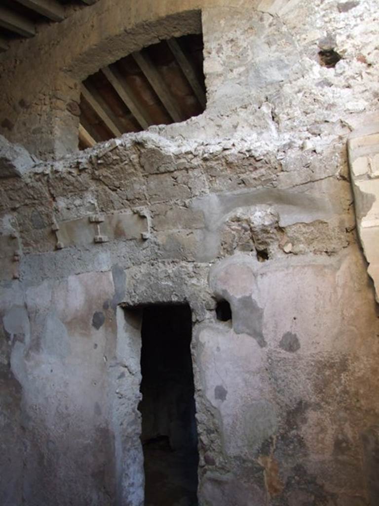 VI.11.9 Pompeii. December 2007. 
Room 21, baths area. Tepidarium south wall and doorway into caldarium 22.