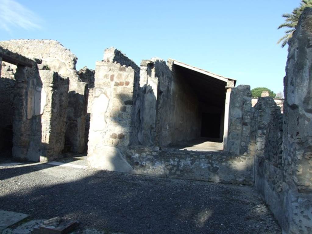VI.11.9 Pompeii. December 2007. 
Room 3, north-east corner of atrium, looking north into peristyle area across window of room 38.