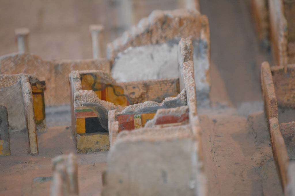 VI.11.9/10 Pompeii. July 2017. Looking towards south-west corner of atrium 3, with Vicolo del Fauno, on right.
Above the yellow/black wall of the atrium is the south wall of room 5, unseen in front of it would be corridor 4.
The red/yellow south panelled wall of room 6 can be seen, with a small part of the remaining red painted upper south wall of west ala 7, in the centre.
From cork model in Naples Archaeological Museum.
Foto Annette Haug, ERC Grant 681269 DÉCOR.