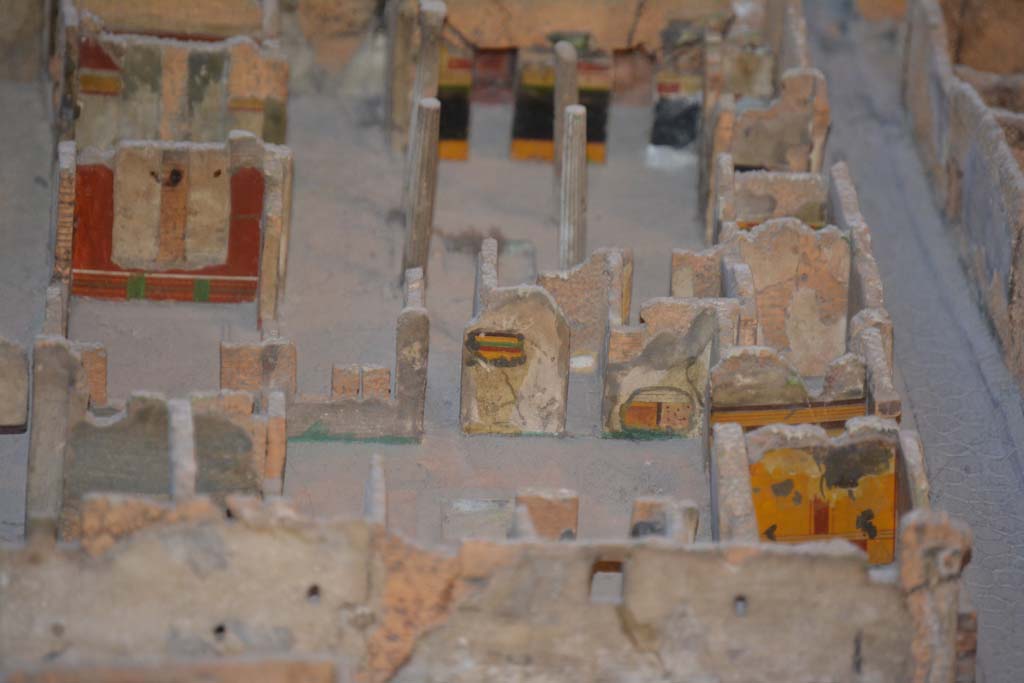 VI.11.9/10 Pompeii. July 2017. Looking east with atrium 3 in centre, and atrium 27, above it.
In the east wall of atrium 3, the yellow/green/red striped upper wall between corridor 48, and room 29, can be seen as well as the painted lower wall in south-east corner. 
The yellow wall (next to Vicolo di Mercurio) is the east wall of room 5.
On the left side of the photo is the red east wall of room 35.
At the rear of room 35 is the east wall of tablinum 33.
In the upper centre is the black/yellow wall of the east wall of atrium 27.
From cork model in Naples Archaeological Museum.
Foto Annette Haug, ERC Grant 681269 DÉCOR.