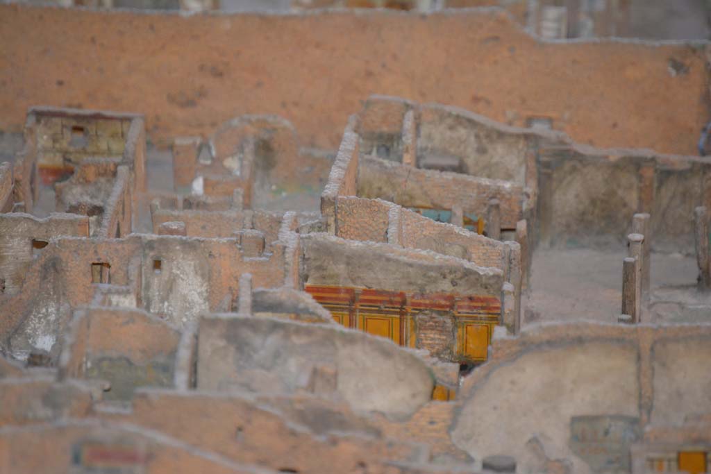 VI.11.9/10 Pompeii. July 2017. 
Looking towards east wall of peristyle 36, with east walls of rooms 40, (yellow painted, lower left), 42, 43 and 46, visible in centre.
From cork model in Naples Archaeological Museum.
Foto Annette Haug, ERC Grant 681269 DÉCOR.